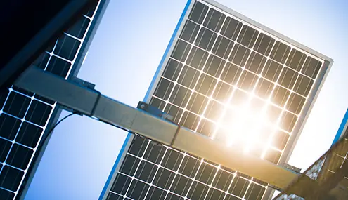 the sun is shining brightly through the solar panels